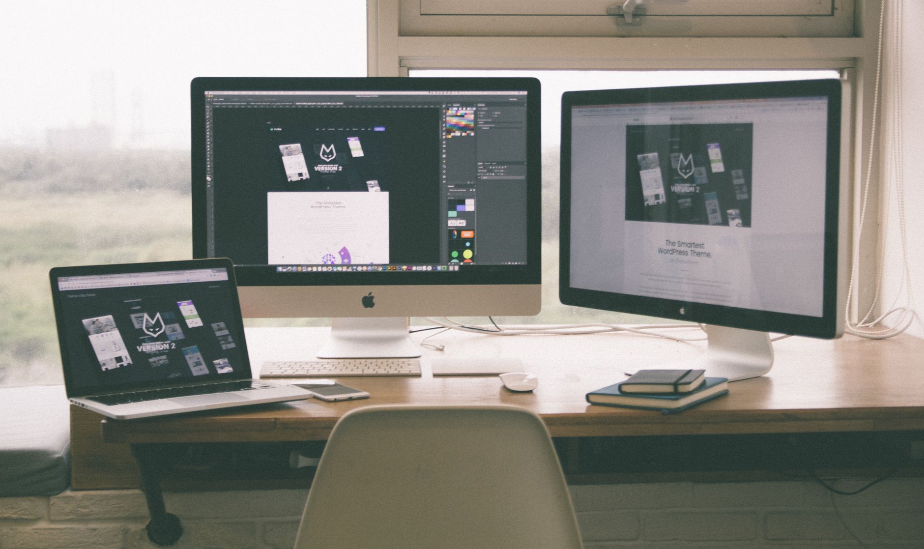 A web designer reviewing a detailed project brief on a laptop, surrounded by design sketches and color palettes.