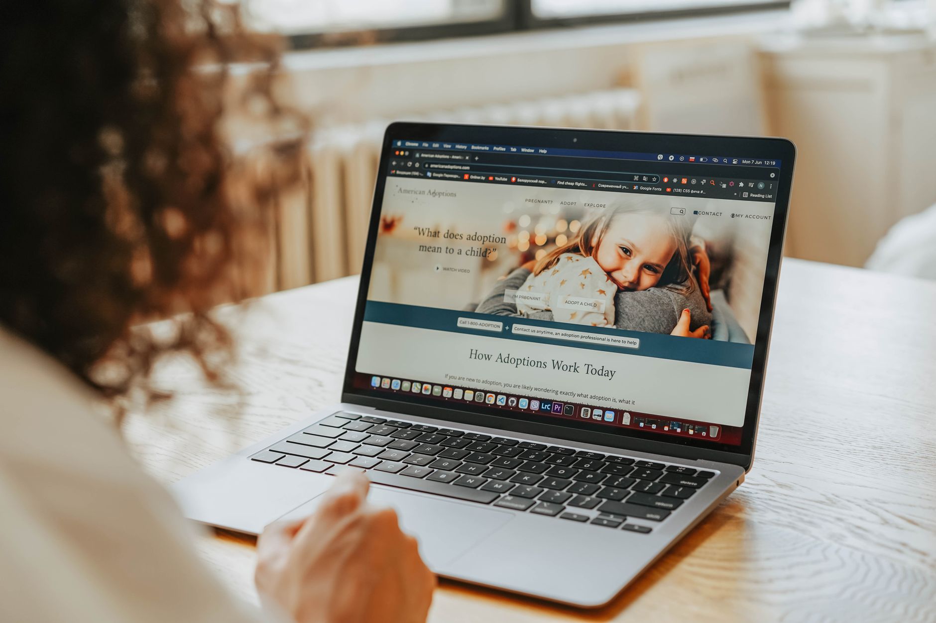 A Melbourne business owner reviewing a website care plan on a laptop.